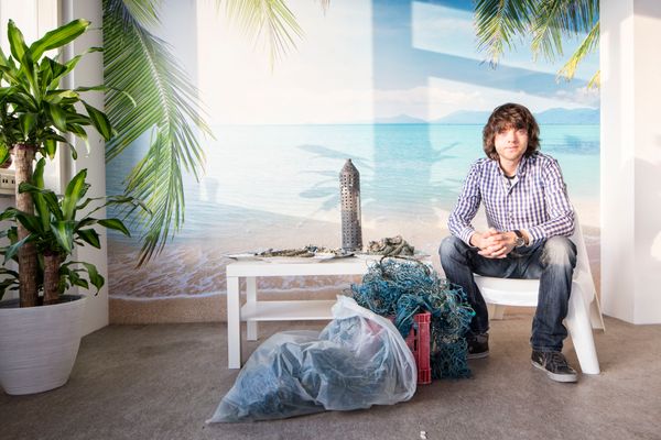 Boyan Slat with macroplastics at The Ocean Cleanup office. Photo by Yuri van Geenen.