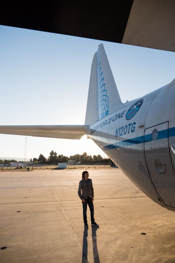 Boyan Slat next to Ocean Force One at Moffett Airfield in Mountain View, California